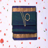 Silk cotton rama green saree with jari boarder.