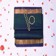Silk cotton rama green saree with jari boarder.