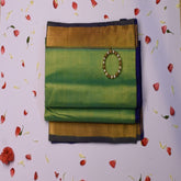 Silk cotton shot green saree with jari boarder