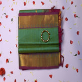Silk cotton pista green saree with pink jari boarder