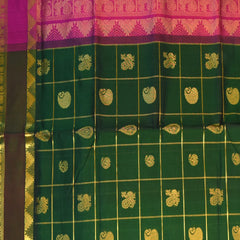 Silk cotton bottle green saree with jari boarder