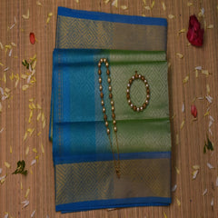 Silk cotton pista green saree with blue boarder