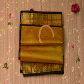 Silk Cotton mustard yellow saree with bottle green jari boarder