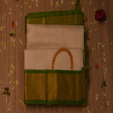 Silk cotton half white saree with green boarder