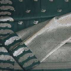 Semi silk cotton bottle green saree with jari boarder